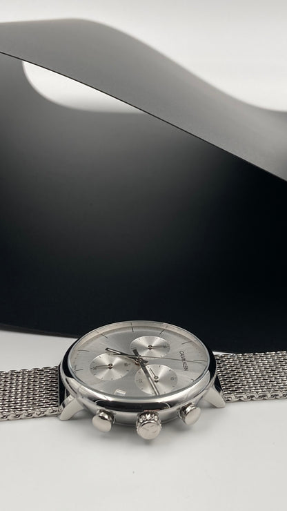 Neue, in der Schweiz hergestellte CALVIN KLEIN High Noon Chronograph Quarz Herrenuhr mit silbernem Zifferblatt